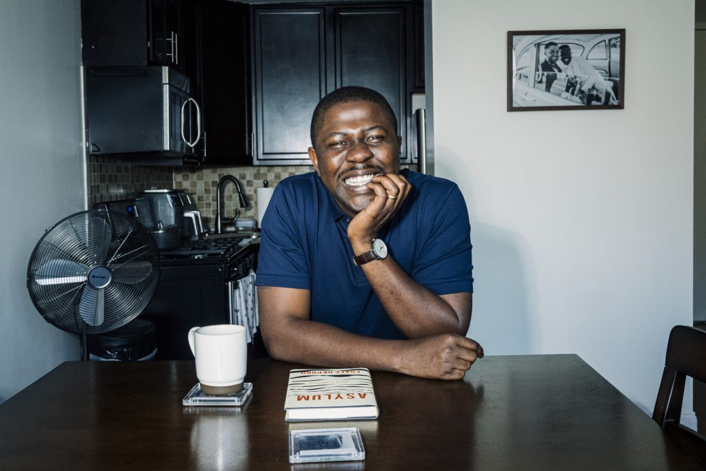 Image of Edafe with his book