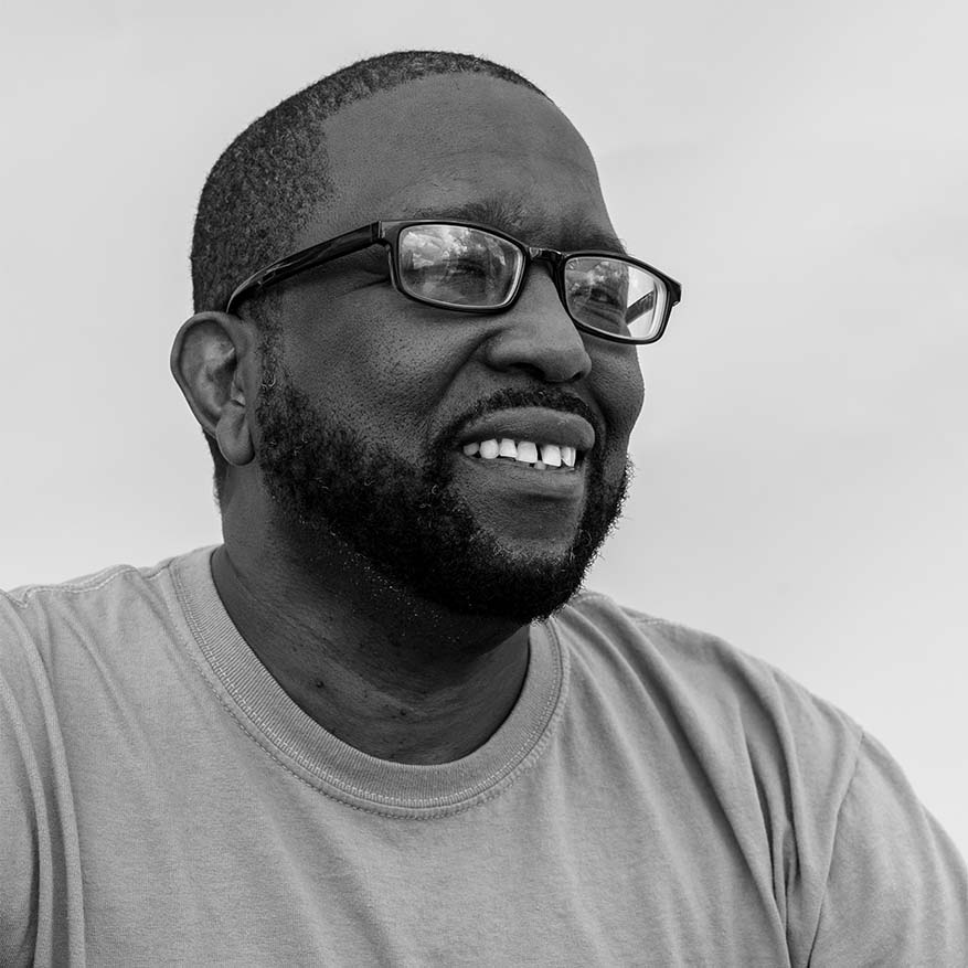 Black and white photograph of Ken Lewis, founder of The Drivers Cooperative