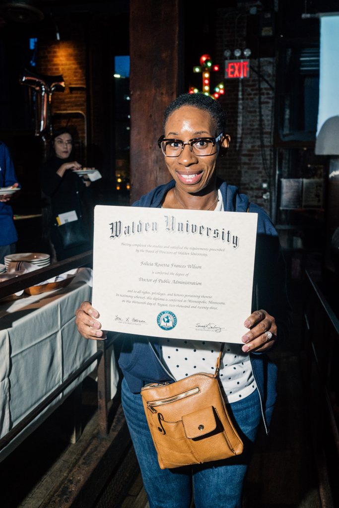 Felicia with her PhD diploma