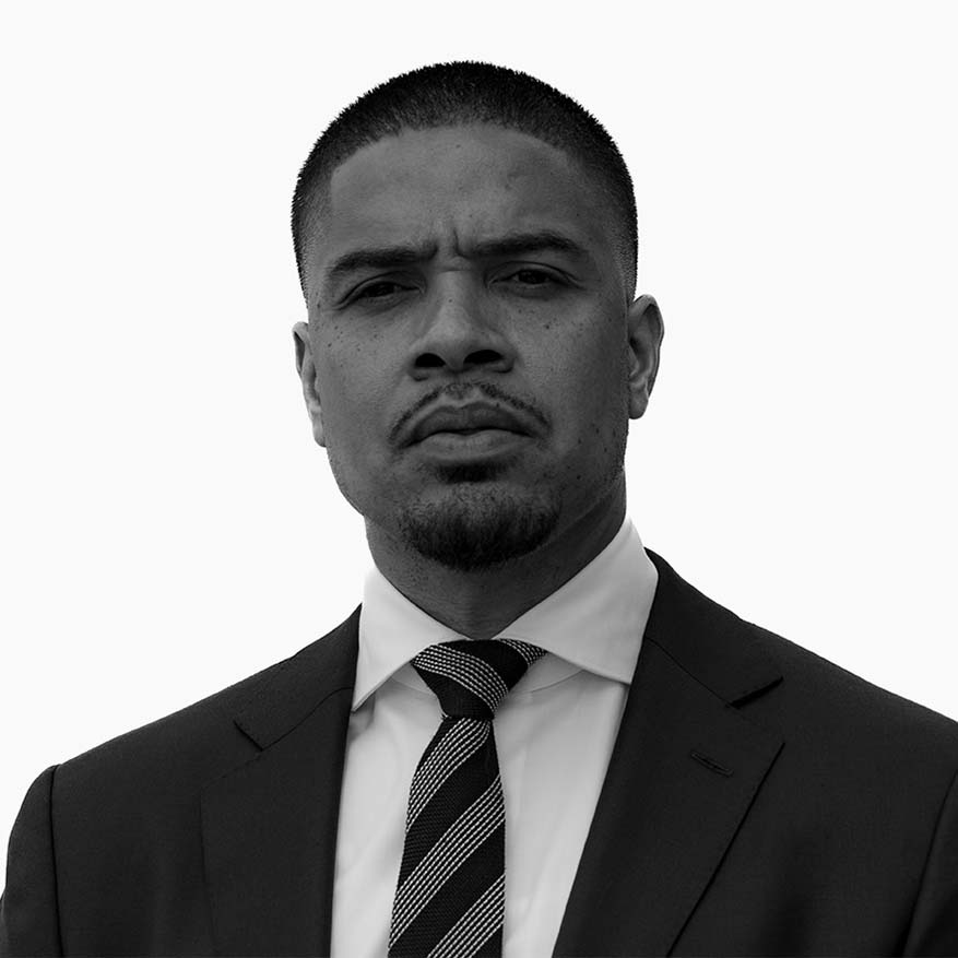 Black and white photograph of Jason Gibson who is teaching free coding classes to NYCHA’s youngest learners.