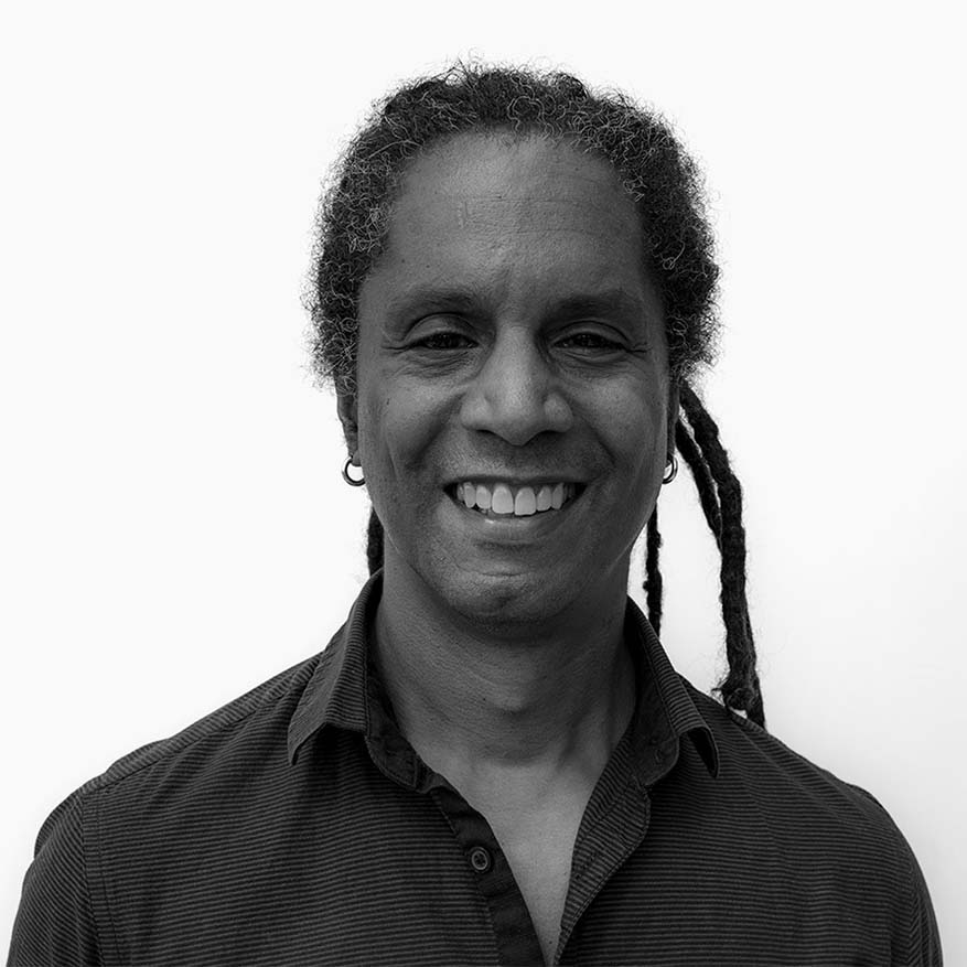 Black and white photograph of Mark Winston-Griffith against a white backdrop