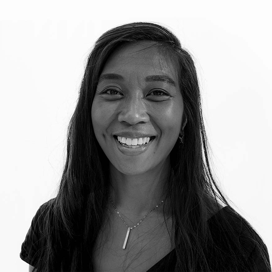 Black and white photograph of Myla Flores who is building a community-based pregnancy and reproductive center for NYC birthing people that offers safe, accessible, and family-rooted midwifery and doula services