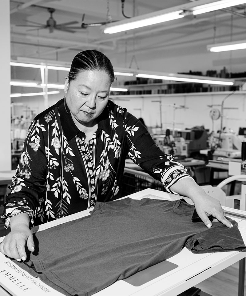 Image of Mi Jong Lee working on a t-shirt
